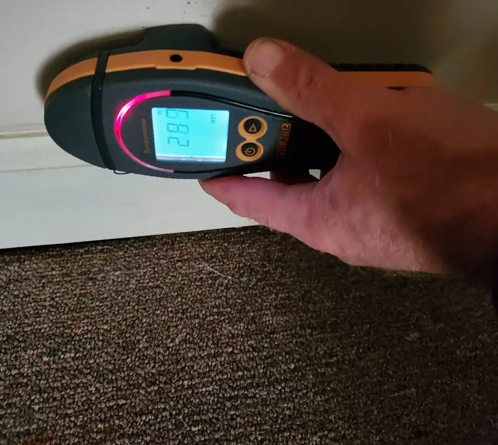 Moisture detection at baseboard during Storm Damage Restoration in Leesburg